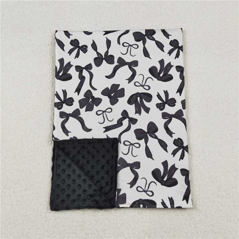 X109 BL0217 Beige baby blanket with black bow pattern